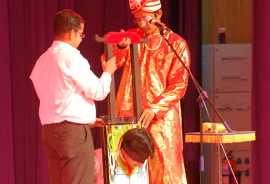 Magician Philip performing Head Choper Illusion